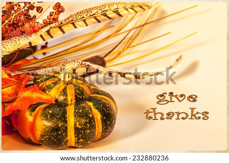 A Happy Thanksgiving card, with autumn decorations and text