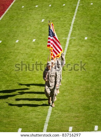 TALLAHASSEE, FL - OCT. 16:  Military recruits walk off football field after national anthem at Florida State University vs. Boston College football game at Doak Campbell Stadium on October 16, 2010.