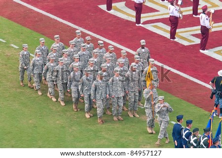 TALLAHASSEE, FL - SEPT. 26:  Military recruits walk off football field after national anthem at Florida State University vs. South Florida football game at Doak Campbell Stadium on Sept. 26, 2009. in Tallahassee, FL.