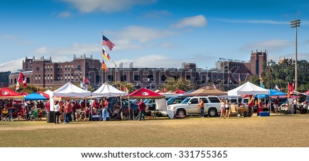 TALLAHASSEE, FL - NOV. 16, 2013:  FSU fans tailgating outside Doak Campbell Stadium before a home game against Syracuse University.  Tailgating in the open parking lots owned by the Booster Club.