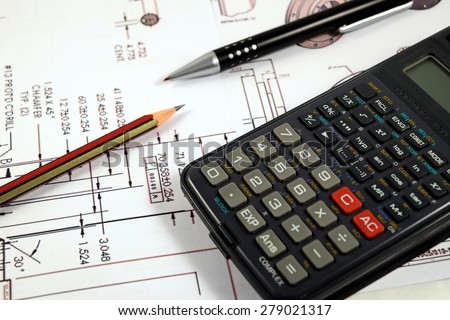Scientific calculator, Pen and Pencil over the Engineering Drawing Map