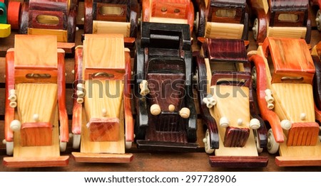 Handmade wooden toys on a wooden base