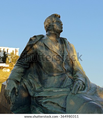 BUCHAREST, ROMANIA - 14 JANUARY 2016: The bronze statue of George Enescu, Romania\'s most famous composer looks out from the grounds of the National Opera House.