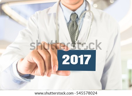 Doctor stethoscope on modern hospital background word 2017 on card