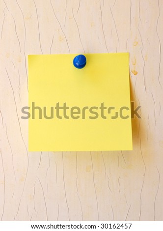 yellow note pad on wooden object