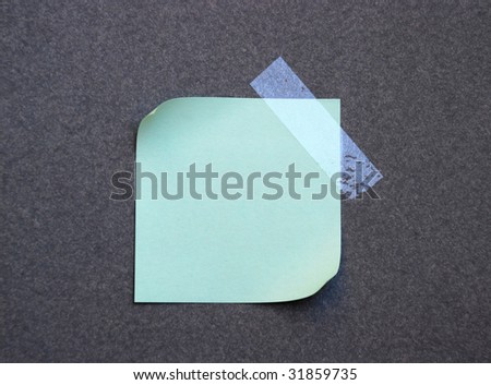 green empty note pad with sticky tape