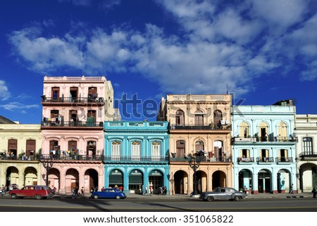 Cuba, Havana - 28. November 2015 - street scene with people, colorful buildings and old cars