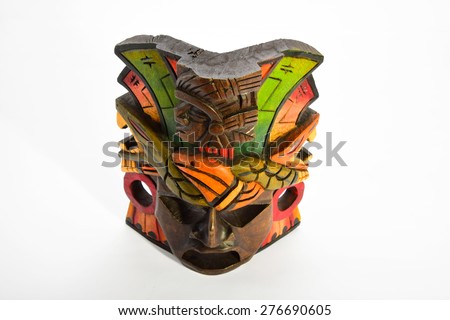 Indian Mayan Aztec wooden mask with anaconda and jaguar isolated on white background (top angle view)