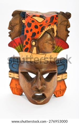 Indian Mayan Aztec wooden painted mask with roaring jaguar and human profiles isolated on white background (front, full face, upper take)
