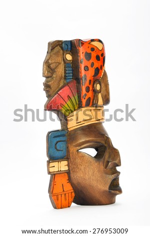 Indian Mayan Aztec wooden painted mask with roaring jaguar and human profiles isolated on white background (left side)