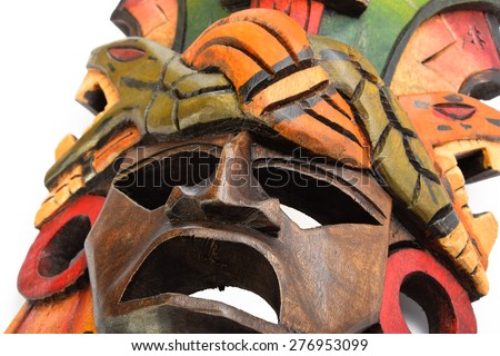 Indian Mayan Aztec wooden mask with anaconda and jaguar isolated on white background (bottom up diagonal angle)