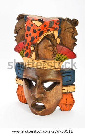 Indian Mayan Aztec wooden painted mask with roaring jaguar and human profiles isolated on white background (right side, ~ 15 degrees, upper take)