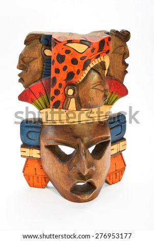 Indian Mayan Aztec wooden painted mask with roaring jaguar and human profiles isolated on white background (left side, ~ 15 degrees, upper take)