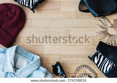 Flat lay fashion set : Jean jacket, sunglasses, hat, leather backpack, shoes and accessories
