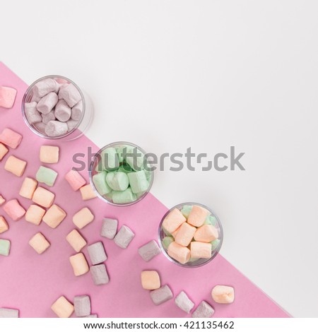 Sweets in glasses on pastel backgrounds. Fashion style Minimalism Set. Flat lay, Top view.
