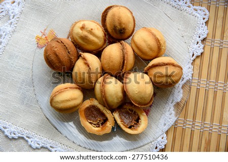 Sweet nuts Cake with condensed milk in a transparent plate