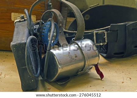 Old miners headlamp and self rescuer, Derbyshire, England.