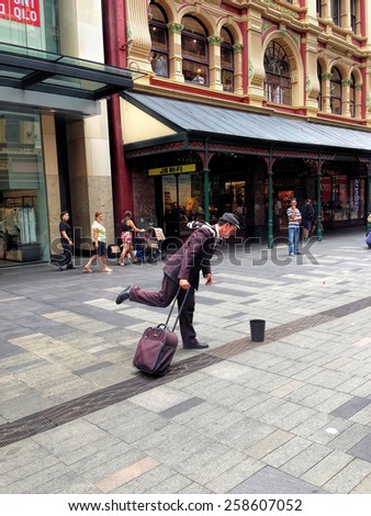 SYDNEY, NSW, AUSTRALIA - January 10, 2015: A street performer dressed as a tourist \