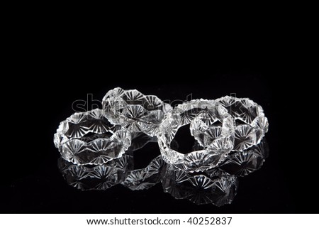 Cut Glass Napkin Rings on a black background
