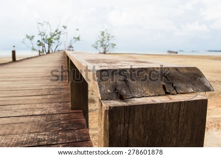 wooden railing on wood bridge,thailand