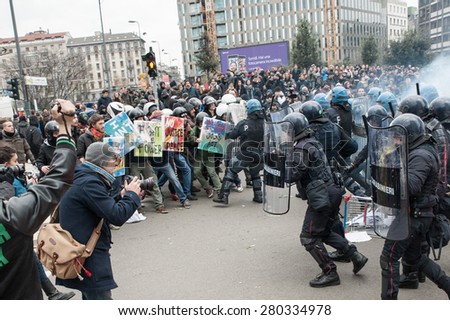 Milan, december 12, 2014 - Police in full riot gear charge on protesting students at the end of the march in solidarity with the general strike called by Unions in Rome and Turin.