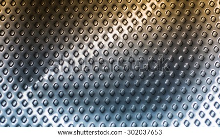 Curved gold metal background with perforated holes.