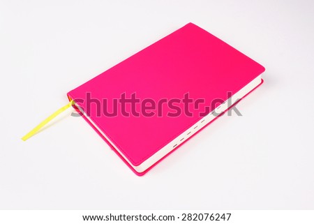 Pink notebook on white background isolated
