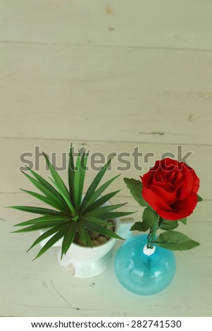 Vase of red flowers on a table