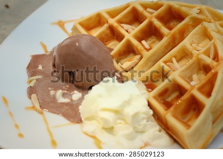Belgium waffles with ice cream at cake shop.