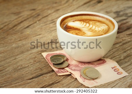 Hot latte coffee with money of Thai Bath