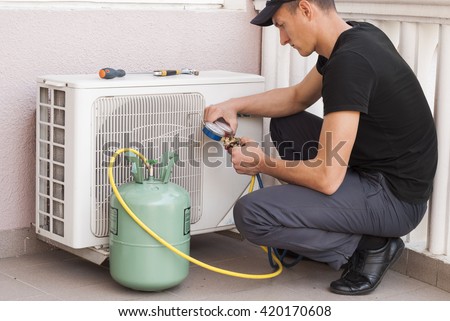 master of repair air conditioners at work