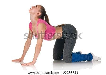 young happy woman does fitness exercise on white background on all fours