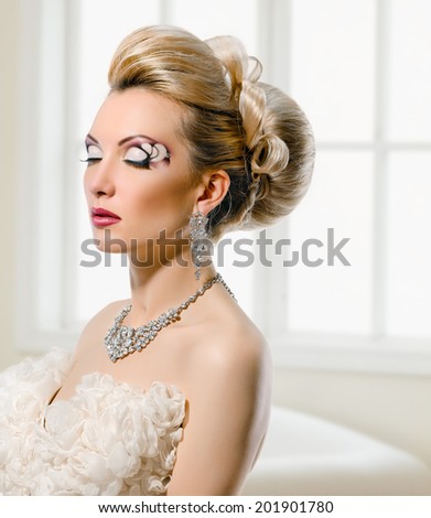 Fashion Beauty Model. Bride. Creative Make up and Hair Style. On window background