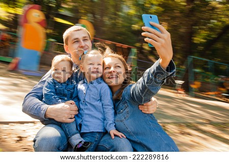Family having fun on spinning roundabout selfie Portrait Naturally blur motion Family having fun on spinning roundabout selfie Portrait Naturally blur motion