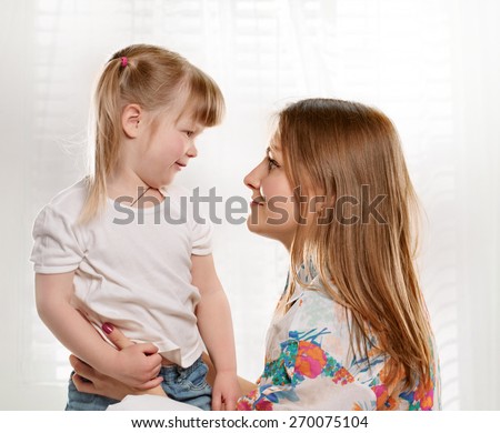 picture of mother and daughter talking with each other