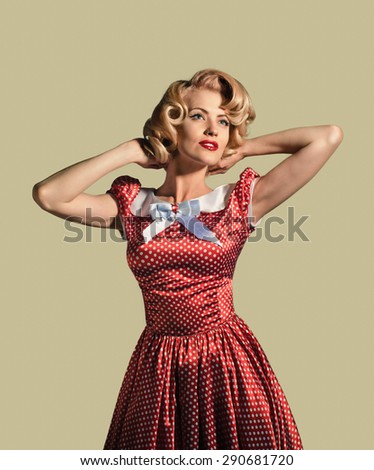young beautiful caucasian woman posing, over dirty yellow background, retro styling, pin up