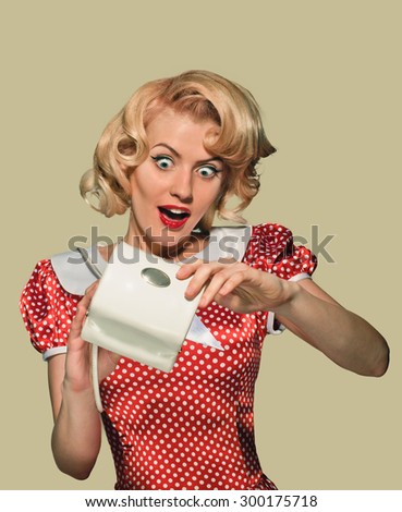 young beautiful caucasian woman posing with purse, in  ecstasy , over dirty yellow background, retro styling, pin up