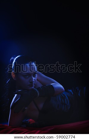 beautiful woman on red coverlet under the moon-light