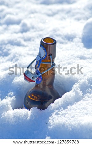Beer bottle in snow