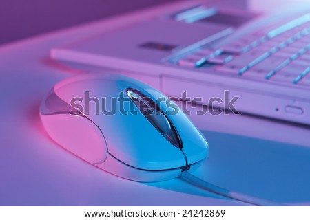 White computer mouse in color light