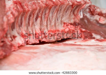 Pork loin with ribs over pork fat