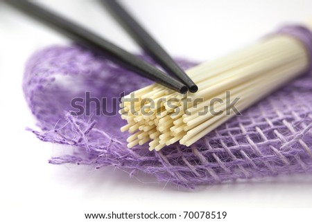 Japan noodles with chopsticks isolated on white