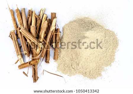 Close up of the roots of Ashwagandha roots and its powder also known as Indian ginseng, isolated on white essential beneficial for hair loss,\
gives strength,increase testosterone,good for your thyroid