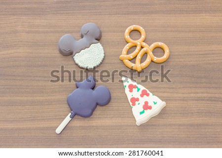 BANGKOK, THAILAND - MAY 27, 2015 : Mickey Mouse magnets on wooden background