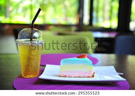 Apple juice and rainbow crepe cake.