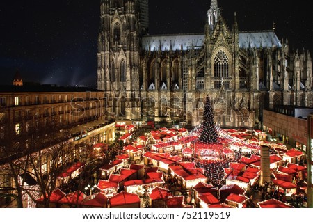 The famous german Cologne Cathedral Christmas Market with Illumination, Christmas Tree and Cathedral in the background.