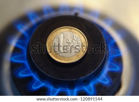 One euro coin on the gas fire