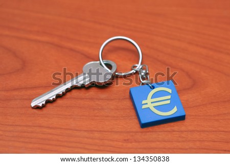 A key with a pendant with Europe union sign