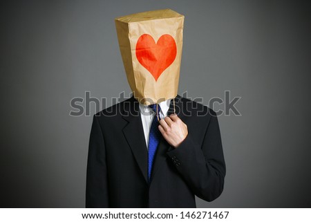 Businessman with a paper bag on head