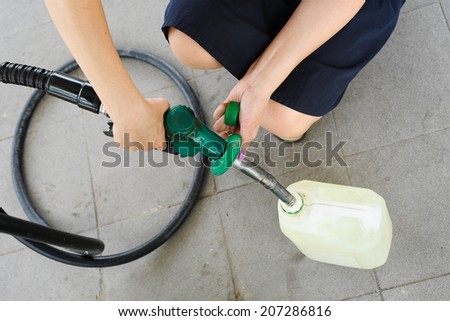 woman filling gas to the canister